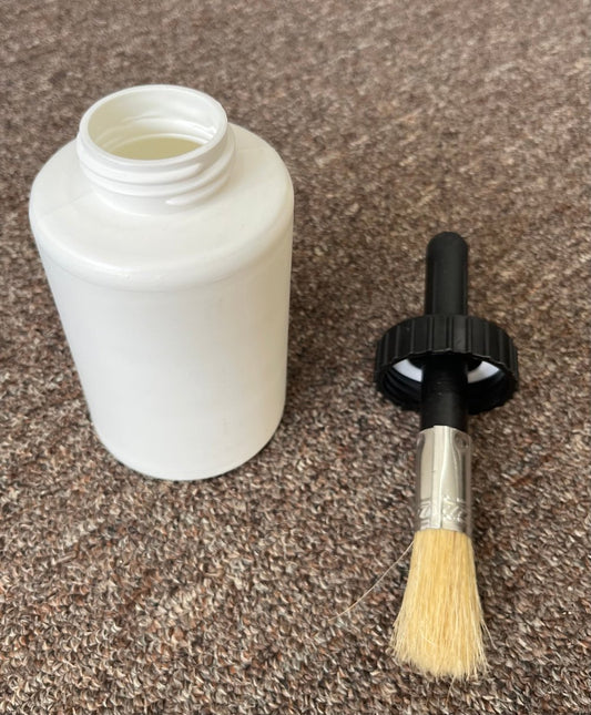 white plastic container with top off.  Top is shown to include an attached hoof brush for equestrian care.