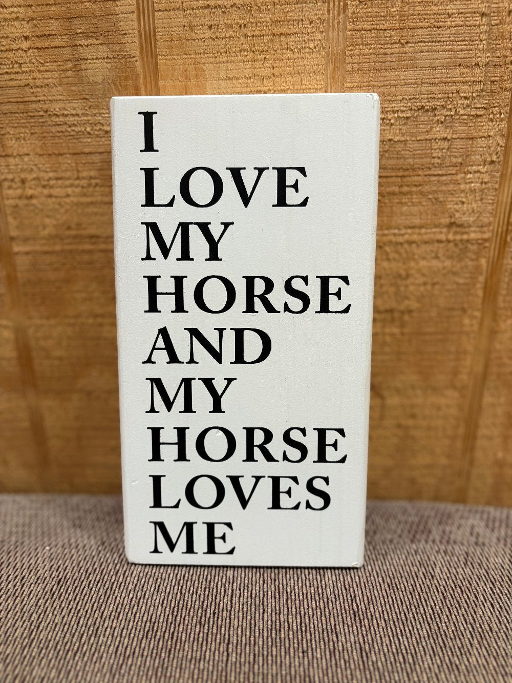 white vertical rectangle wooden shelf sitter decor with black words "I love my horse and my horse loves me"