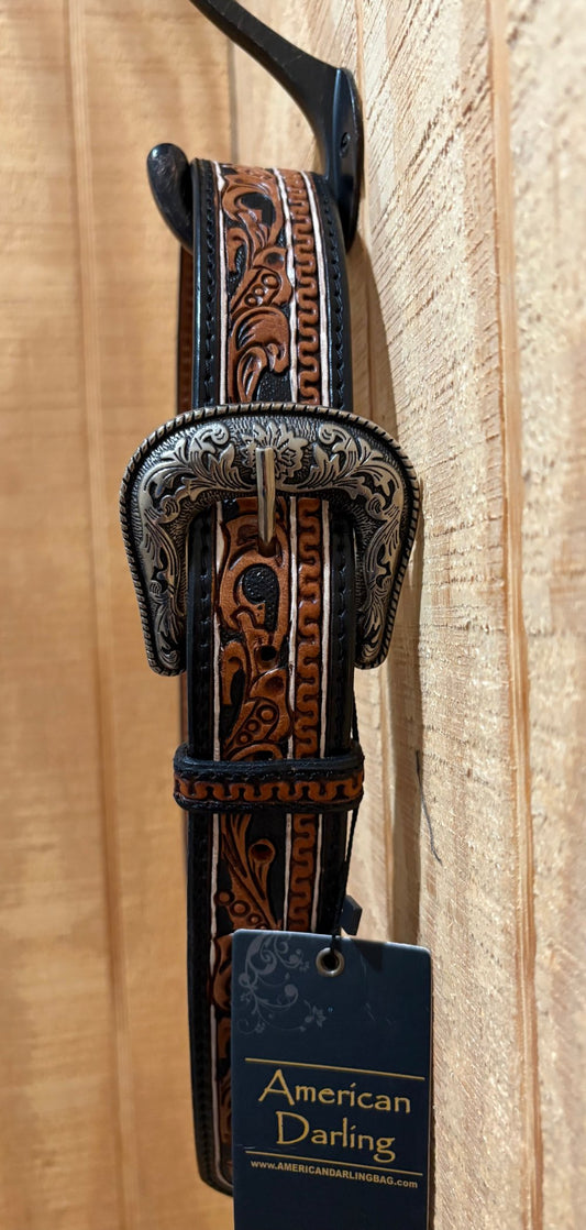 Tooled leather belt with embellished nickel colored buckle.