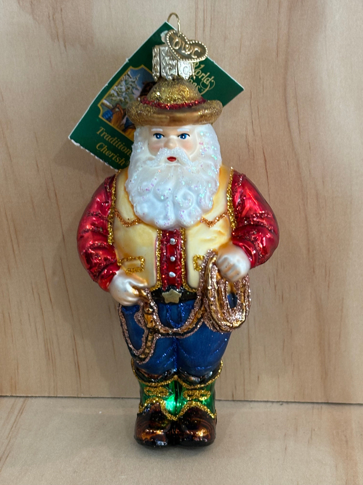 colorful and sparkley glass Santa -dressed as a Cowboy- ornament