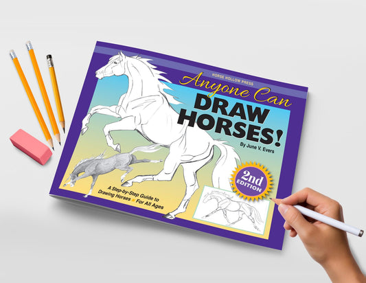Cover of "Anyone can draw horses" book shown with pencils and eraser