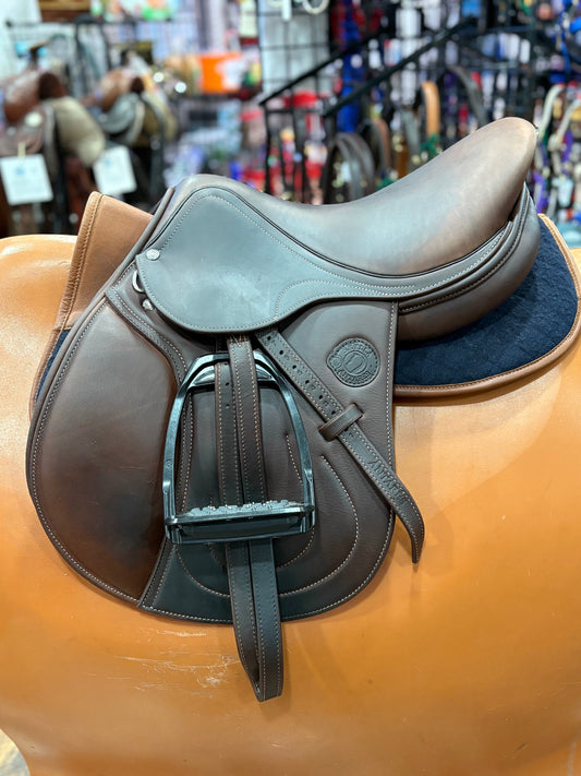 Brown leather english saddle with the Antares stamp logo.  Shown with stirrups and half pad