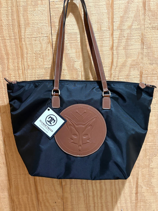 Black nylon handbag with chestnut leather accents and embossed fox on front