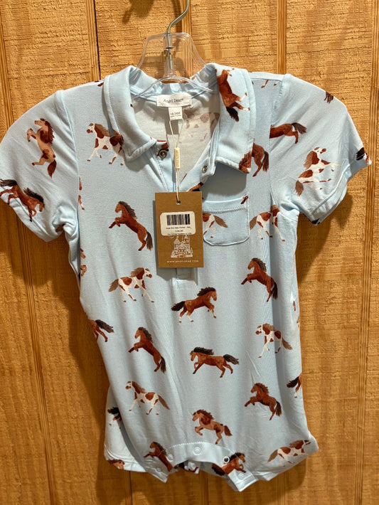 Baby romper with horse pattern on a wooden surface