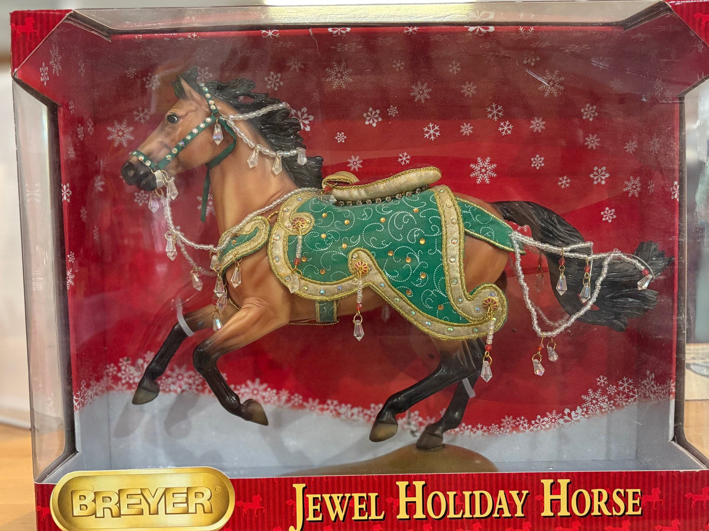 Breyer Jewel Holiday Horse in packaging with a red background