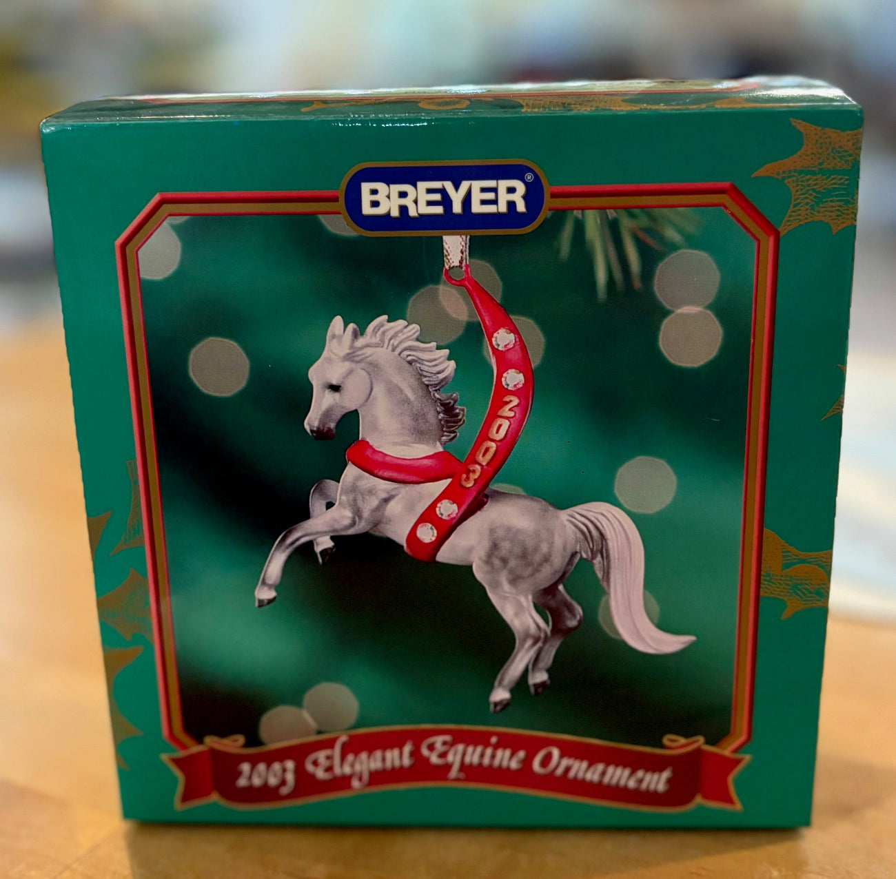 Breyer horse ornament packaging with a horse figure on a green background