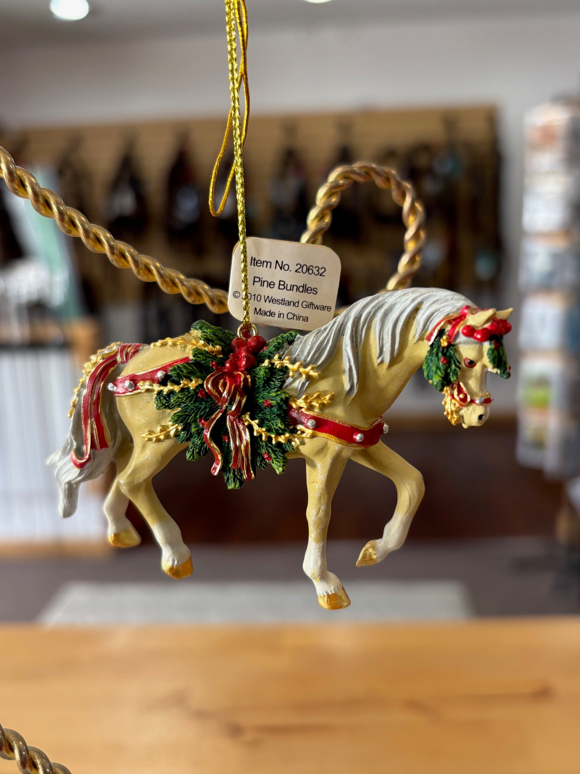 Decorative palomino horse ornament  on a blurred background