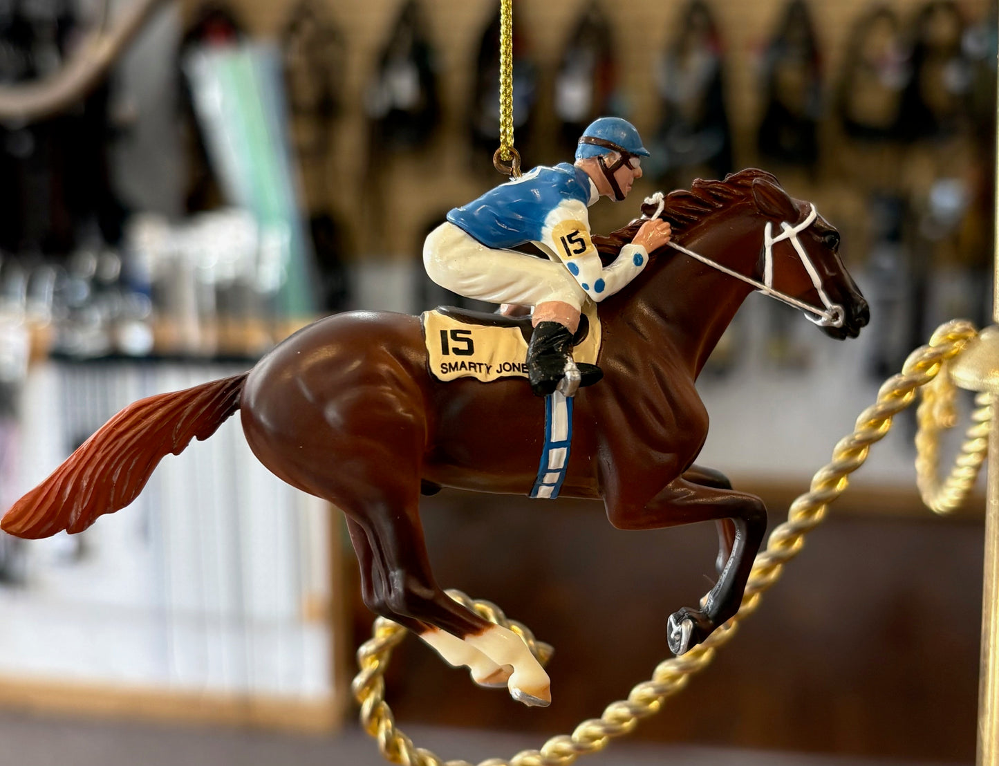 Decorative horse and jockey ornament with a blurred background