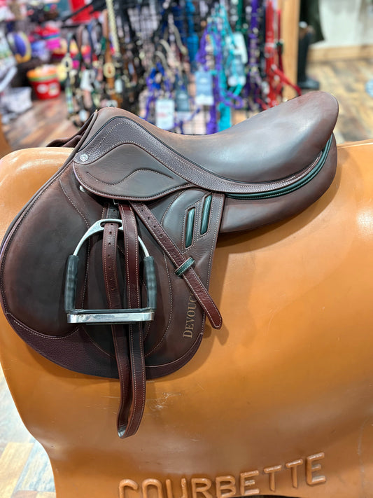 Havana leather english saddle with stirrups on a stand 