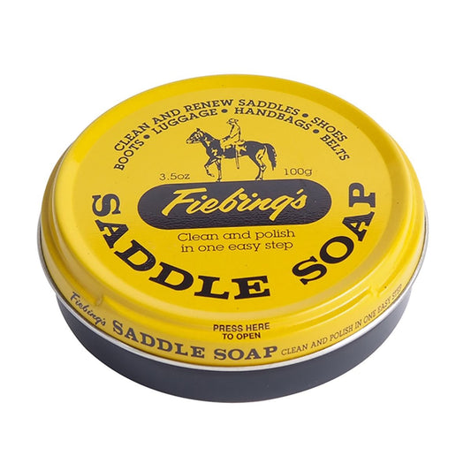 brown round disk shaped can with yellow top.  brown letters "Fiebing's Saddle Soap"