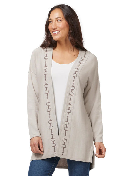 Woman modeling a beige cardigan sweater with equestrian Dee Bit design down the front.  below hip length