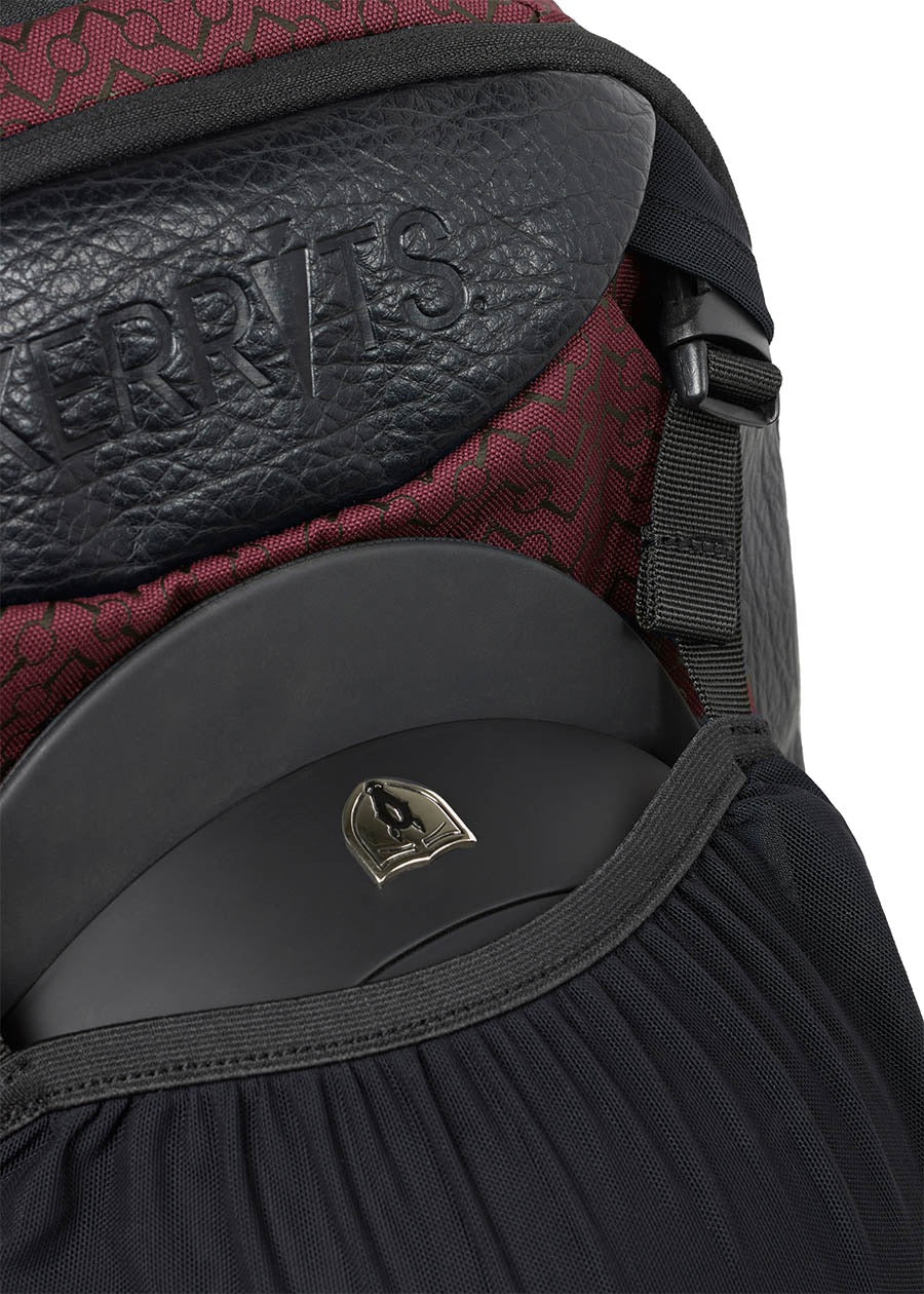 Kerrits equestrian back pack with close up showing how a riding helmet is stored.