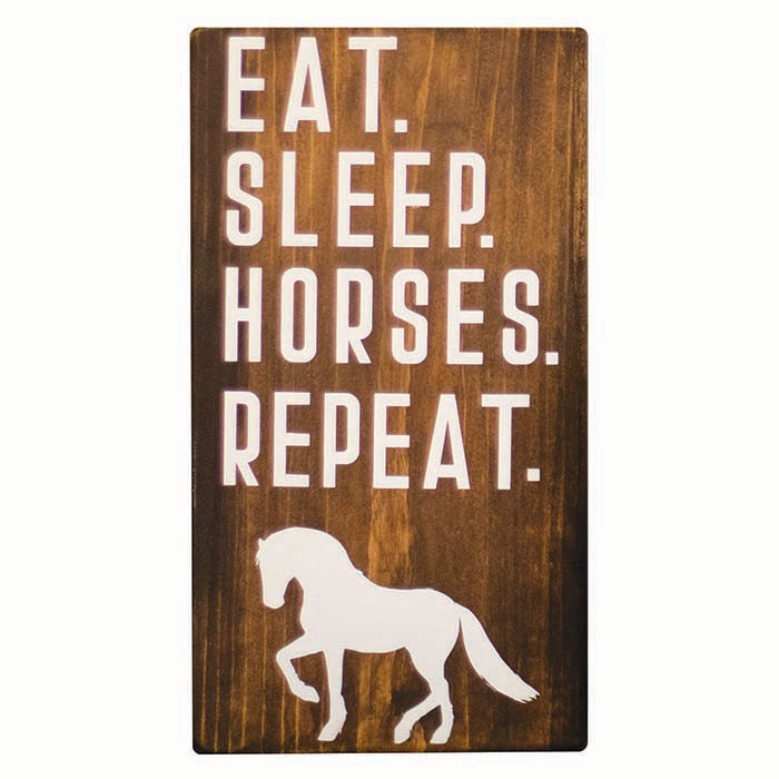 wooden block with "EAT. SLEEP. HORSES. REPEAT." written in white with a white silhouette of a horse