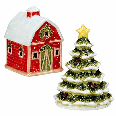 Decorative ceramic Christmas house and tree salt and pepper shaker on a white background