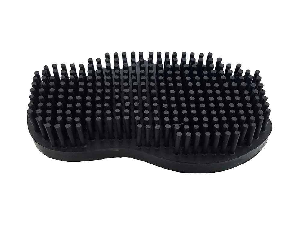 Black rubber grooming brush with bristles on a white background