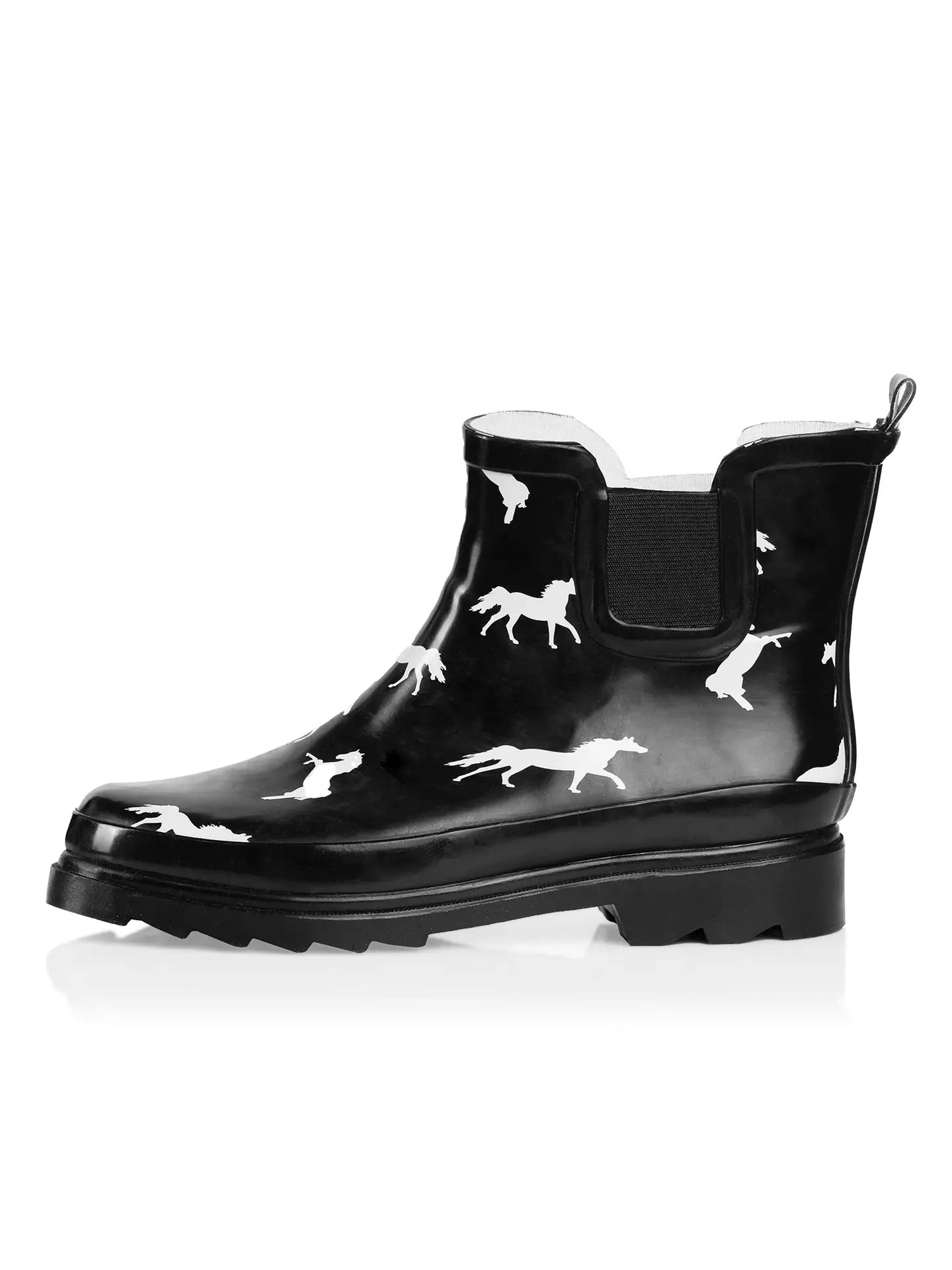 Side view of a black rubber ankle boot with white horse pattern.