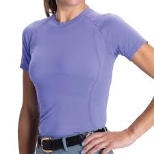 women wearing purple short sleeve riding shirt with right hand on hip with a black belt