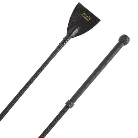 black equestrian riding crop with gold lettering