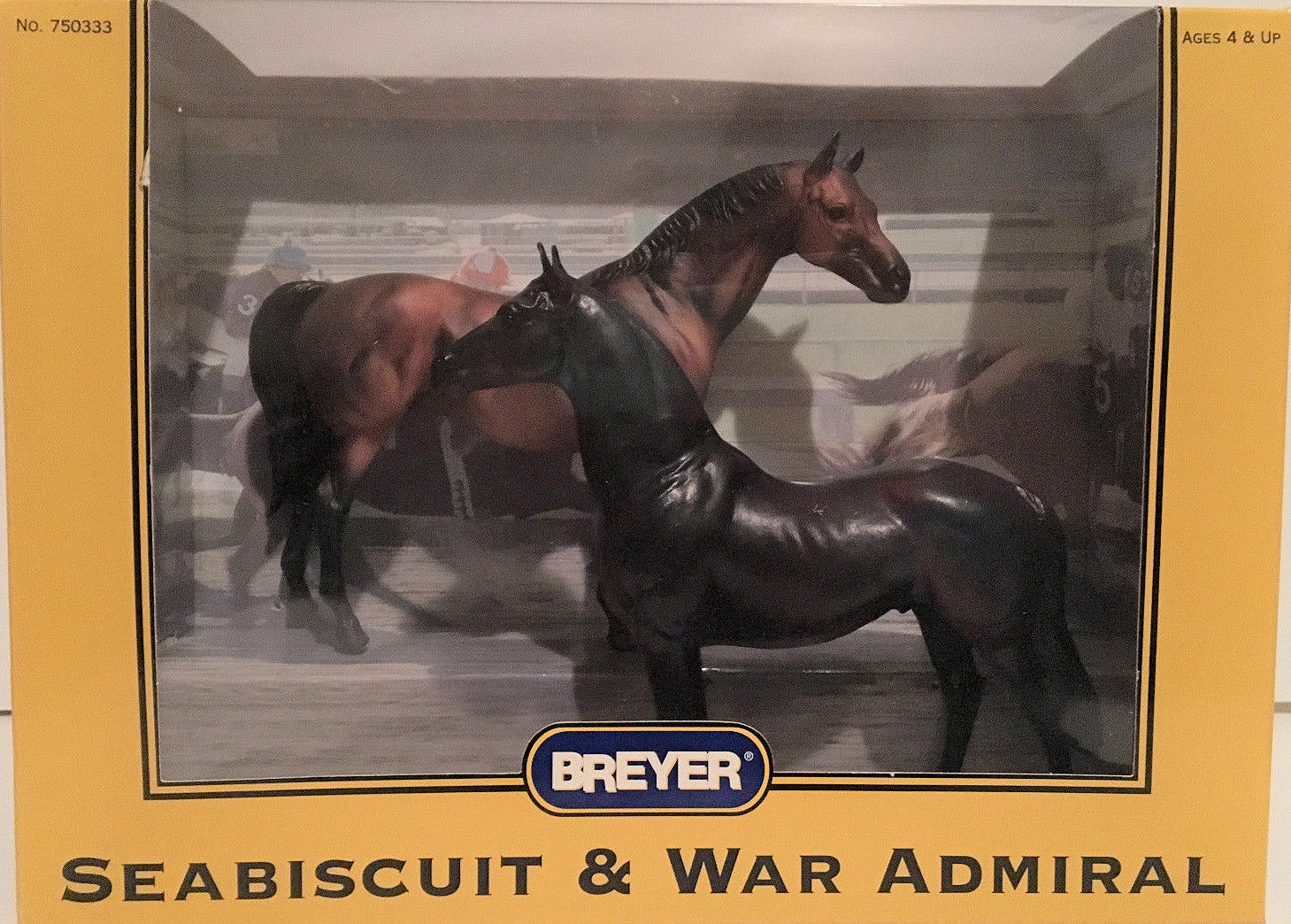 Breyer model horse set in original box packaging, featuring two horses: a dark brown Seabiscuit and a dark gray War Admiral, displayed through a clear window on a yellow box.
