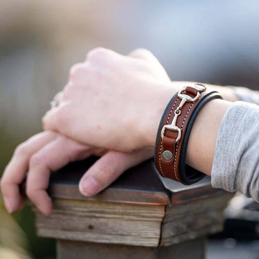 Snaffle bit leather bracelet shown on a wrist
