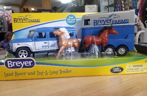 The Land Rover and Tag-A-Long Trailer features die-cast metal vehicle with working doors and rolling wheels. You'll travel in style with the two-horse trailer featuring a drop-down loading ramp.  Comes with 2 ponies:  a bay and a palomino!