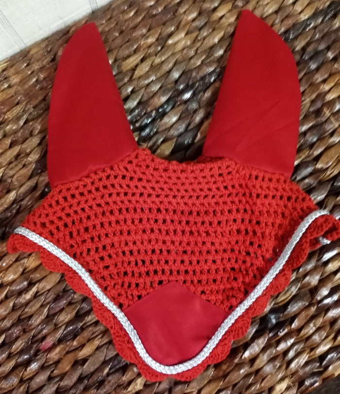 Red colored crochet fly bonnet for a horse. Silver trim.