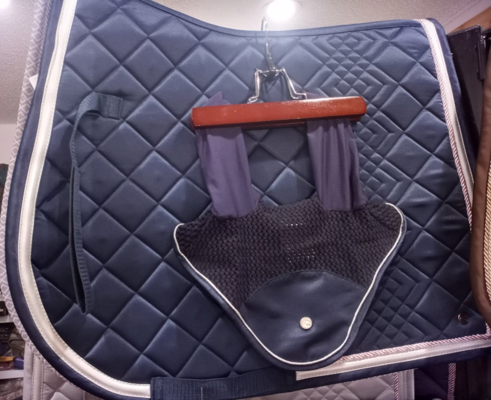 Beautiful navy equestrian saddle pad shown with matching fly bonnet.