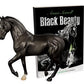 beautiful model of a prancing black horse displayed in front of the book "black beauty"