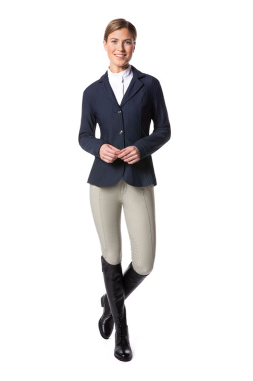 Woman figure modeling an equestrian english style show jacket with tan breeches and black tall boots.