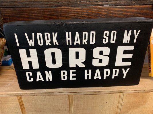 Black  wooden block with the quote "I work hard so my horse can be happy"  