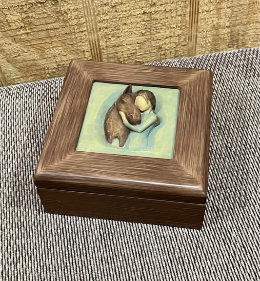 Wooden memory box with raised image of a girl hugging her horse.
