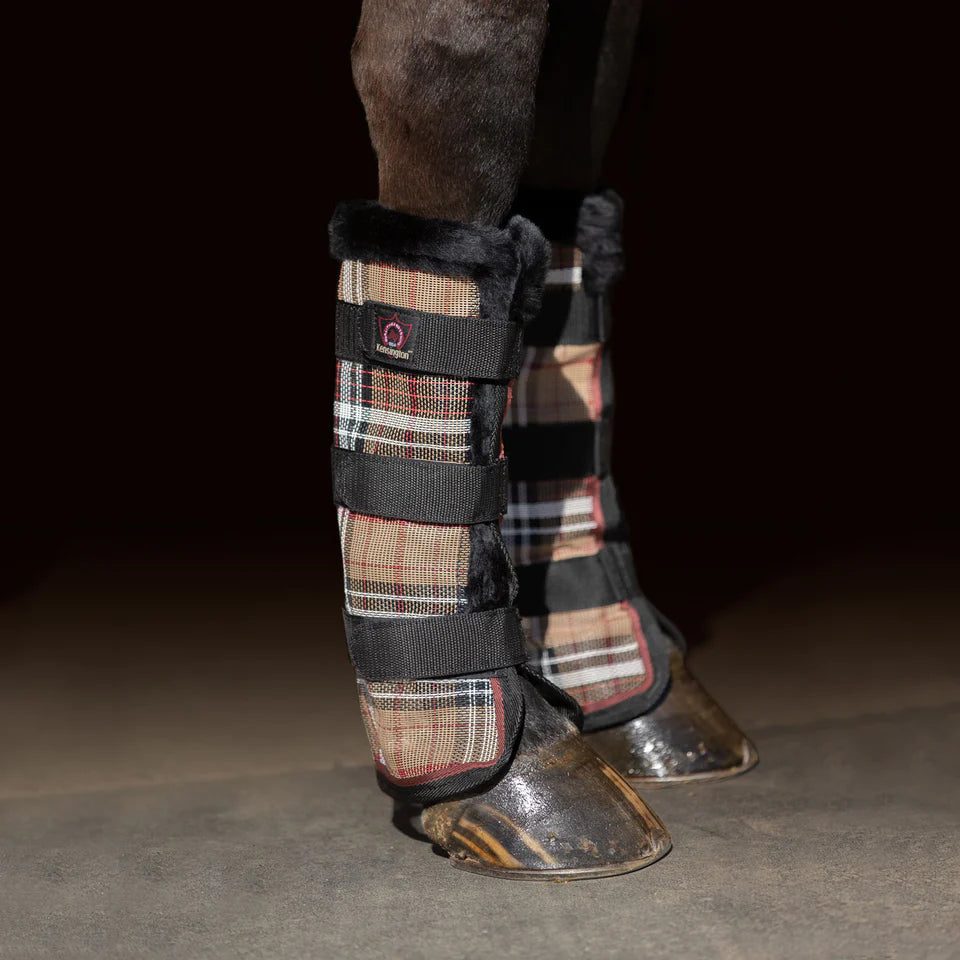 Horse leg with black and brown plaid fly protection with three velcro bands
