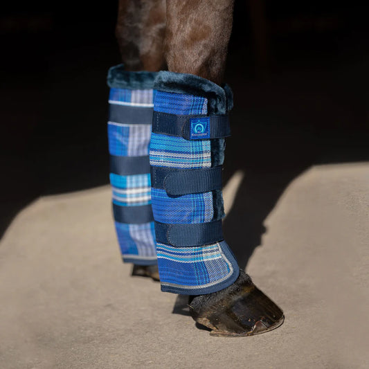 Horse leg with blue plaid fly protection with three velcro bands