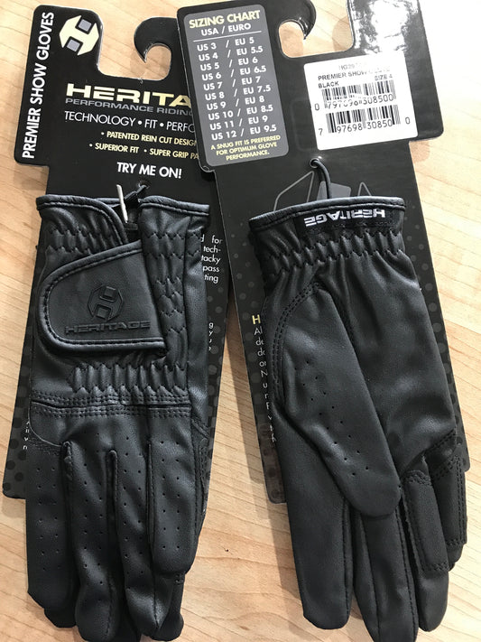Black equestrian show gloves with velcro wrist.  Heritage logo on package hanger and velcro wrist closure.