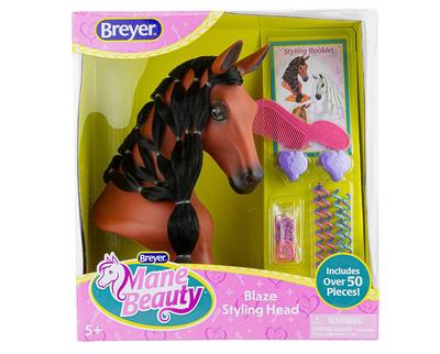 Breyer brown horse head with a long black mane so that kids can brush and braid.  Displayed in box along with accessories styling tools
