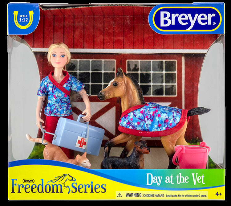 Breyer Day at the vet set. Included in set is; 6" articulated doll, foal, foal blanket, cat, dog, bucket, vet bag, and stethoscope.