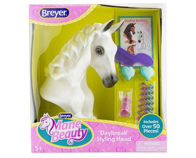 Breyer white horse head with a long mane so that kids can brush and braid.  Displayed in box along with accessories styling tools
