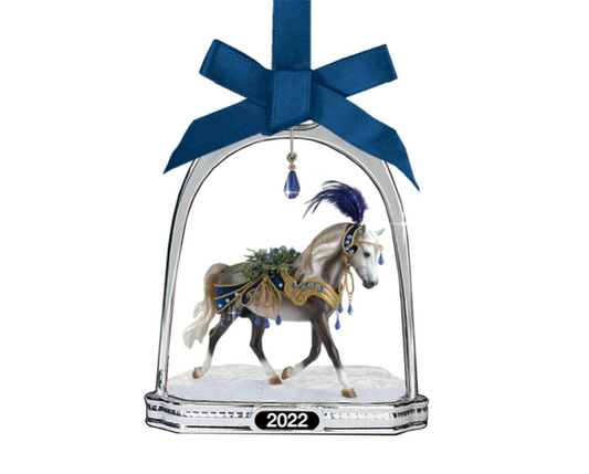 Breyer snowbird ornament with a beautiful blue jewel hanging from the top on the stirrup  